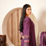 Portrait of a young woman in traditional Pakistani attire indoors in Lahore.